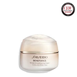 A round, peach-colored jar of Shiseido Benefiance Wrinkle Smoothing Eye Cream. The closed jar features the product name in both English and French.  